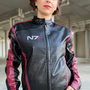 Image shows Mass Effect N7 Jacket Reimagined worn by female model facing front. N7 is a vocational code in the Systems Alliance military. The 