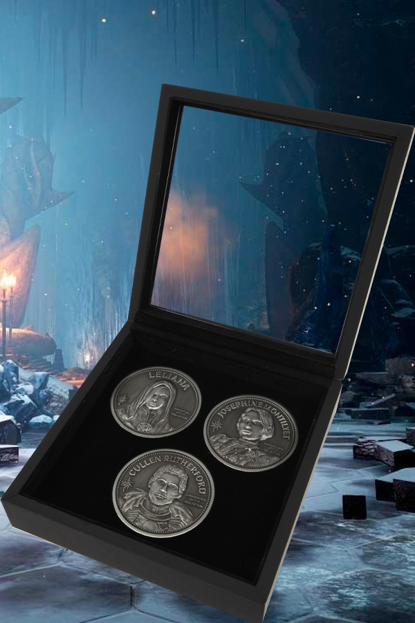 Image shows Dragon Age Three Advisors Coin Set with all the coins all laid out in its box. This coin set pays tribute to the advisors and features their images stamped with their names and titles. The coin set comes in a brilliant wooden display box with a glass top. 