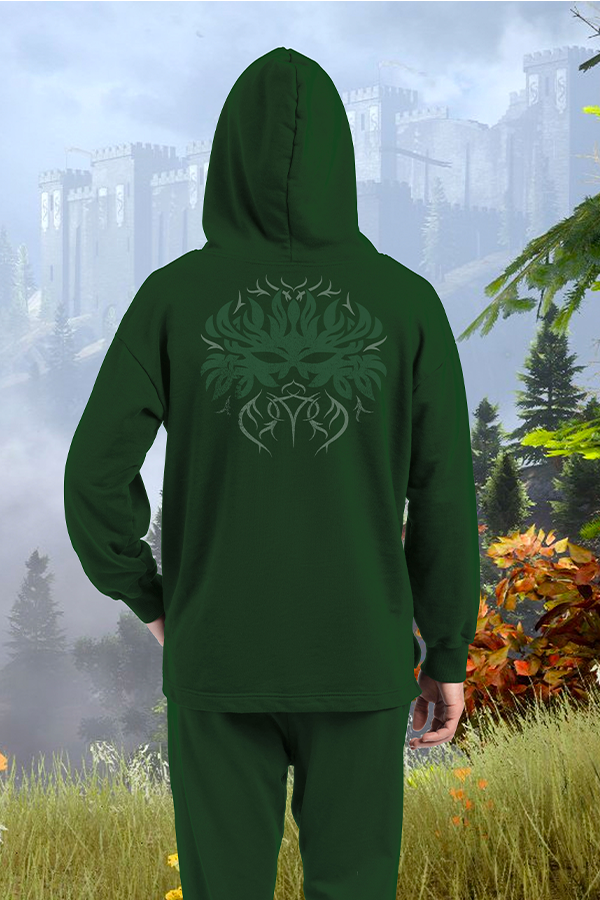 Image shows Dragon Age Dalish Hoodie worn by model facing back. Product features the Dalish heraldry logo at the back. Wear your mark of Vallaslin with pride and stand out wherever you go with this ultra-comfy hoodie. Finished with two welted pockets, an adjustable hood and covered zipper, this embroidered hoodie will be a favorite among your friends and fellow Thedans.