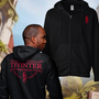Image shows Dragon Age Tevinter Hoodie worn by male model facing back and just the hoodie facing front. Whether you’re mesmerized by the dark magic and rich history of Tevinter Imperium or baffled by the evil that stems out of it, you cannot deny the sheer grandeur of it all. This hoodie features the heraldry of Tevinter on the chest panel and the back. Use it to blend in with the mages or show alliance with the nobility of this twisted magocracy.