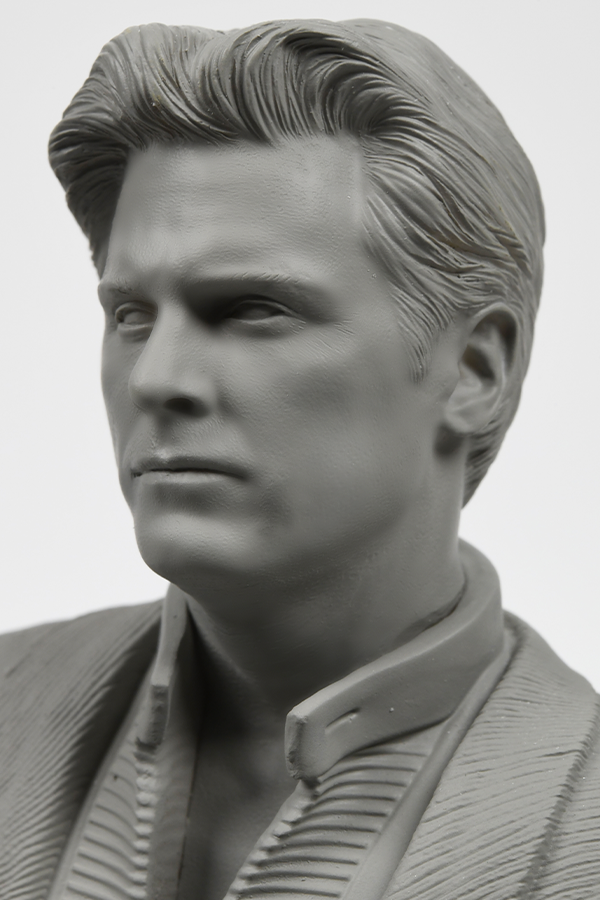 Image shows Illusive Man Prototype Statue's face zoomed in at an angle. Product is unpainted while revealing intricate details and finishing on the statue. 