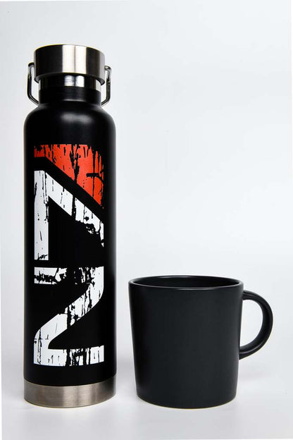 Image shows Mass Effect Distressed N7 Water Bottle standing up beside a mug (for scale). Product features a copper vacuum insulation, threaded insulated lid, carrying handle and high-polish rim.
